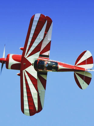 biplane in a sharp turn for an aircraft appraisal